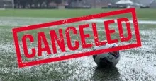 picture of rainy soccer field with canceled written across it.  